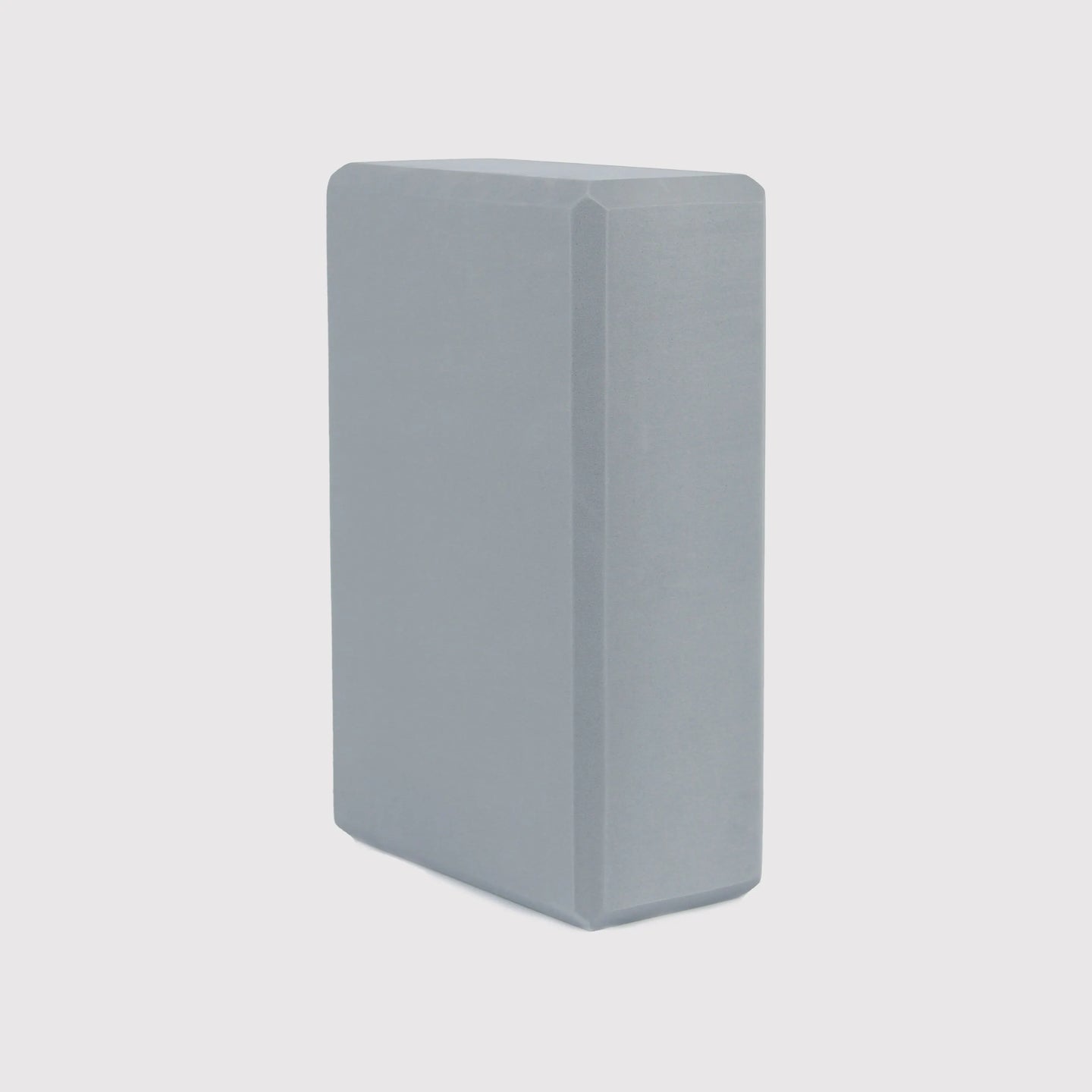 Gray yoga block by Sportive Lives made from eco-friendly high-density EVA foam, designed for stability and support during yoga practice. Available in Canada.