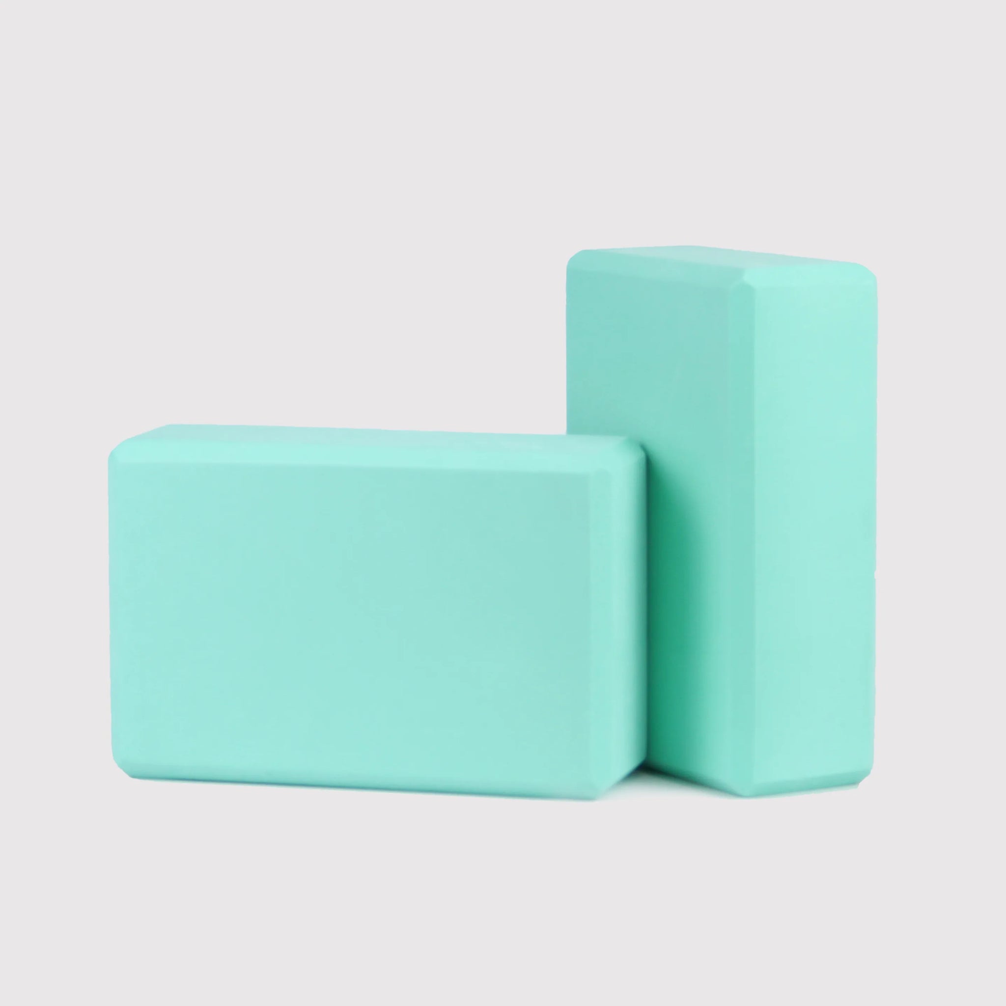 Mint green Yoga Block PURE, eco-friendly EVA foam, offering excellent support and balance for yoga practice. Suitable for various yoga poses.