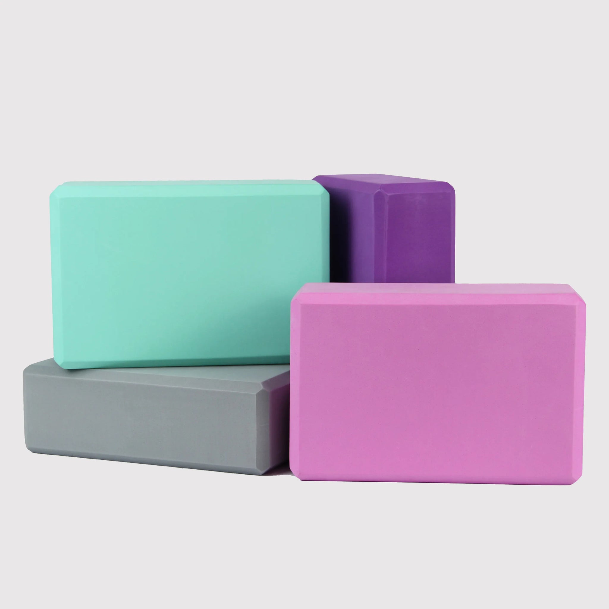 Multi-color Yoga Block PURE set, made from eco-friendly EVA foam, providing stability and support in yoga sessions. Perfect for flexibility and balance enhancement.