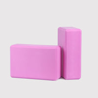 Pink Yoga Block PURE, made of high-density EVA foam, eco-friendly, perfect for stability in yoga practice. Ideal for yoga beginners and professionals.