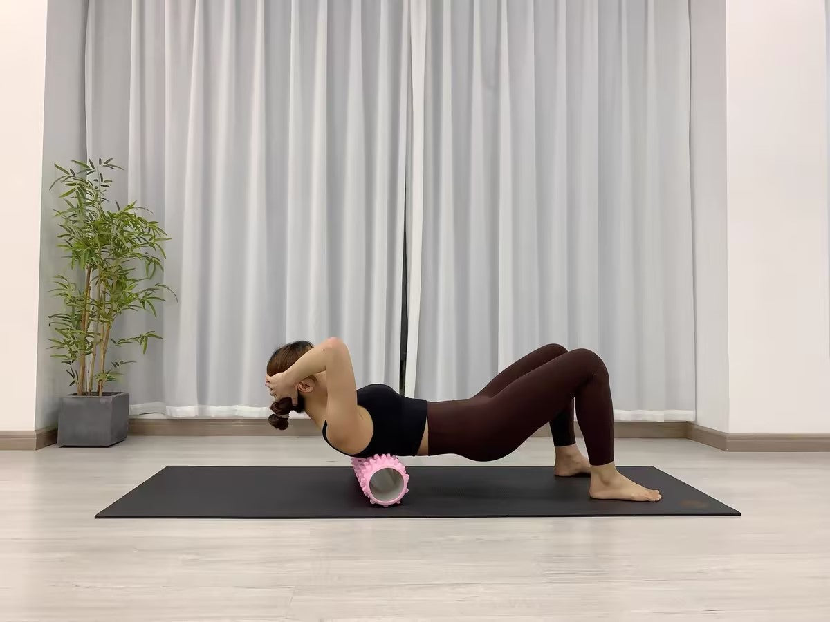 Demonstrating side muscle stretch using the Sportive Lives Foam Roller for deep tissue release. Great for core stability and muscle relaxation. Available in Canada.